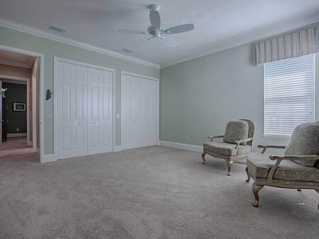 unfurnished room featuring crown molding, light carpet, and ceiling fan