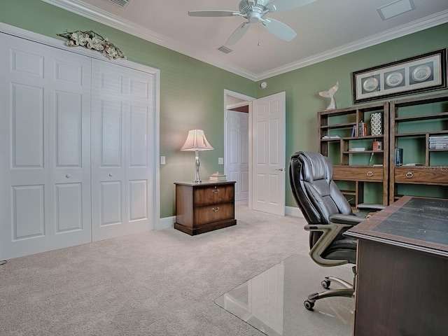 office space with ornamental molding, carpet, and ceiling fan