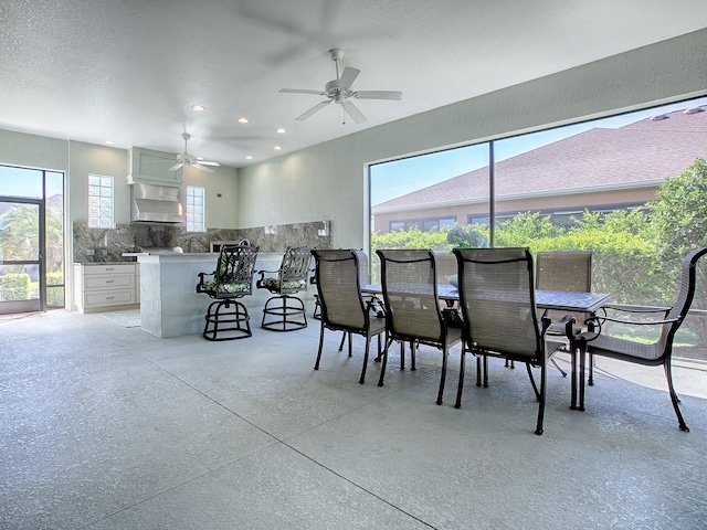 dining space featuring ceiling fan and plenty of natural light