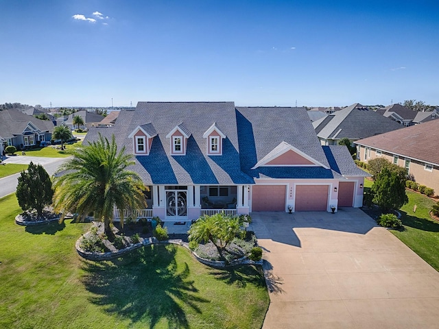 view of front of home featuring covered porch and a front yard