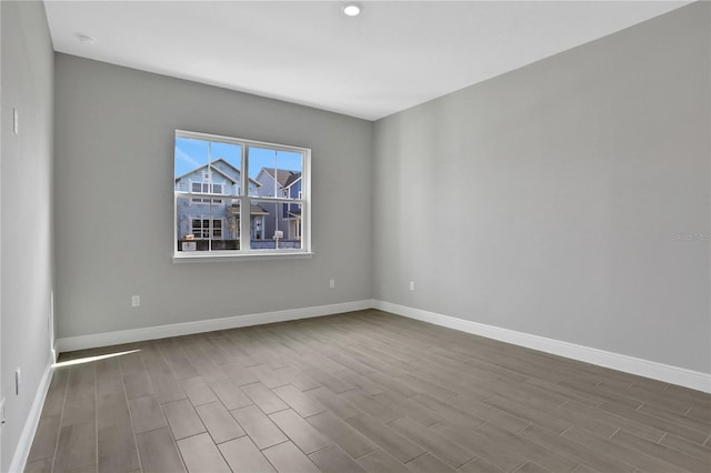 empty room with wood-type flooring