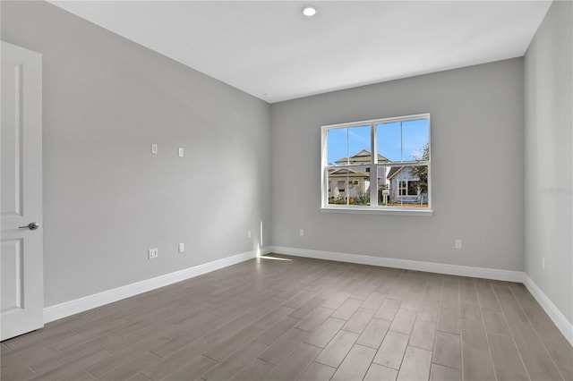 unfurnished room with light hardwood / wood-style floors