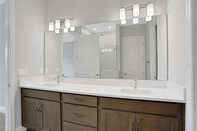 bathroom with vanity and an enclosed shower