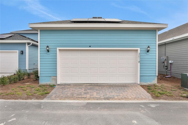 garage featuring solar panels