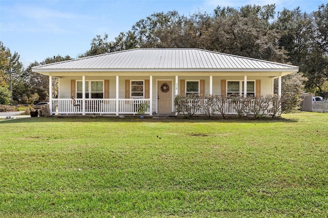 view of front of property with a front yard and covered porch