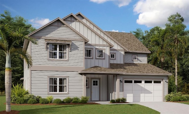 view of front of house with a garage and a front lawn