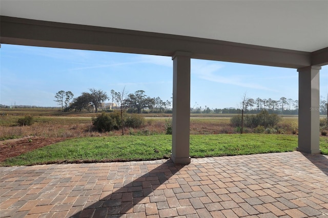 view of patio / terrace with a rural view