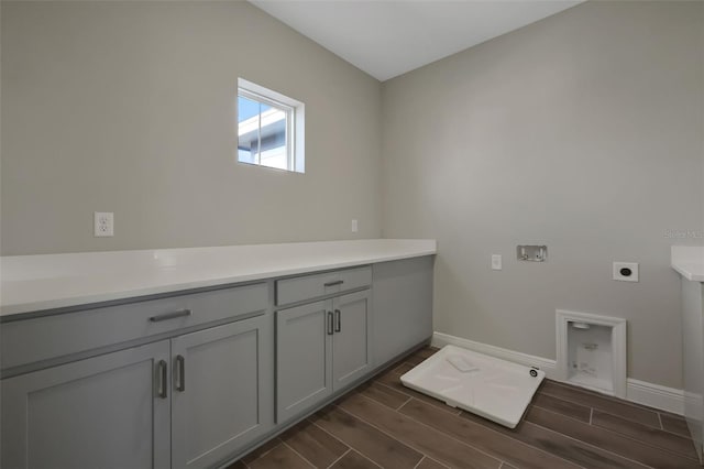 clothes washing area featuring washer hookup, cabinets, and hookup for an electric dryer