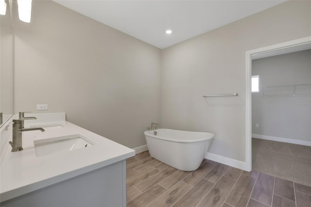 bathroom with a bathtub and vanity