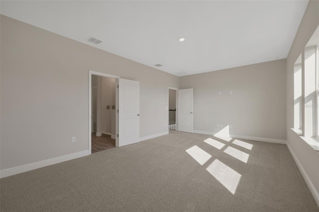 unfurnished bedroom with light carpet