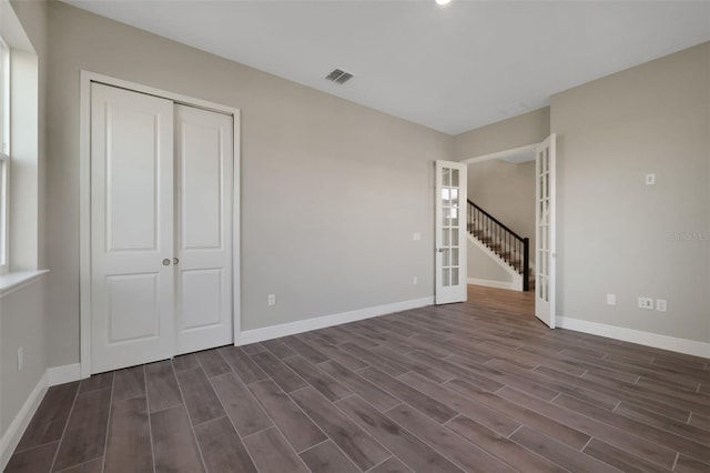 interior space with french doors and a closet