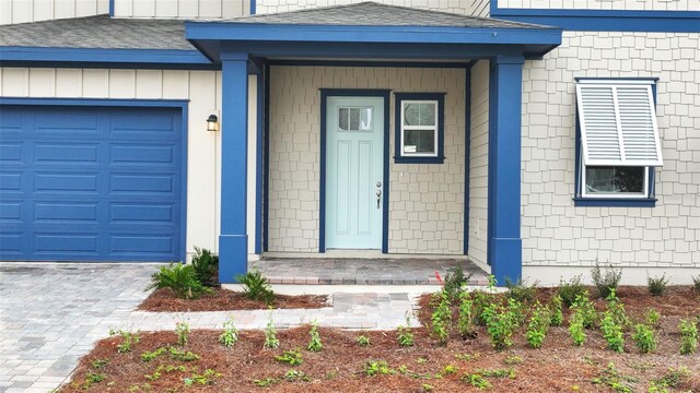 property entrance with a garage