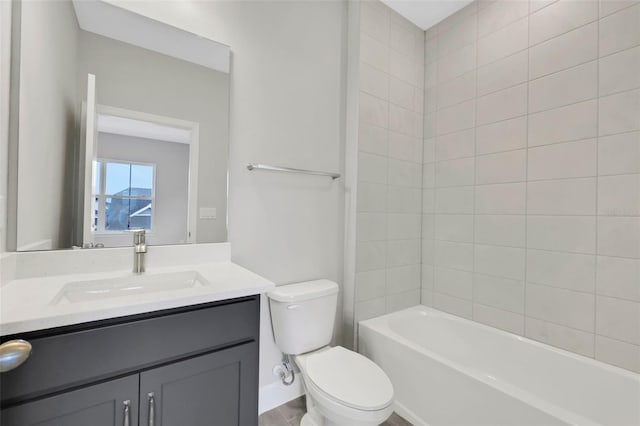 full bathroom featuring vanity, toilet, and tiled shower / bath