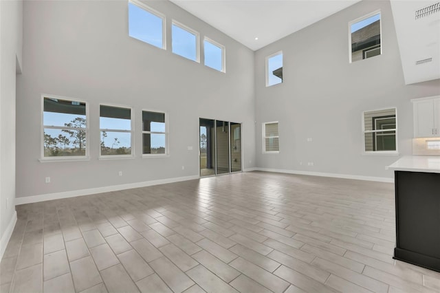 unfurnished living room with light wood-type flooring