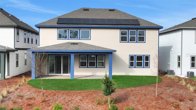 back of house featuring a patio, solar panels, and central AC