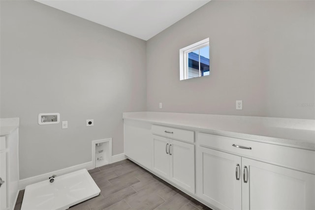 laundry area with cabinets, hookup for an electric dryer, and washer hookup