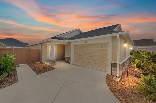 ranch-style home featuring a garage