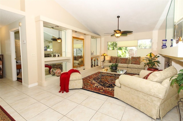 tiled living room with ceiling fan and lofted ceiling