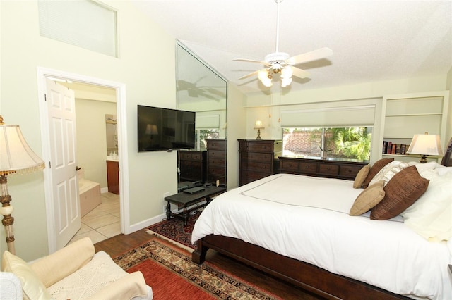 tiled bedroom featuring ceiling fan