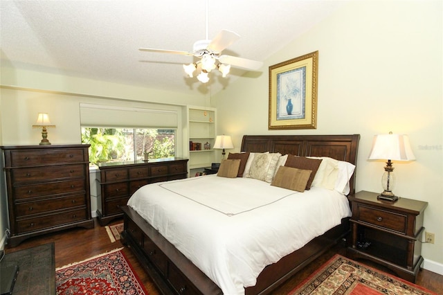 bedroom with dark hardwood / wood-style flooring, vaulted ceiling, and ceiling fan