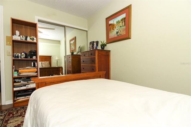 bedroom with a closet and a textured ceiling