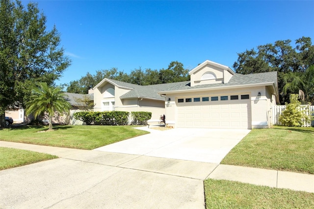 view of front of home featuring a garage and a front lawn