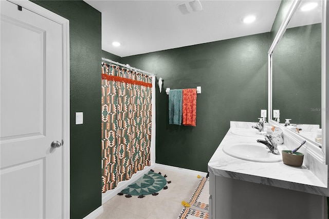 bathroom with tile patterned flooring and vanity