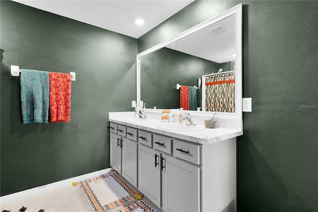 bathroom with tile patterned floors and vanity