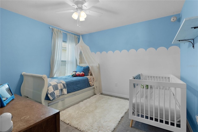 bedroom with ceiling fan and carpet floors