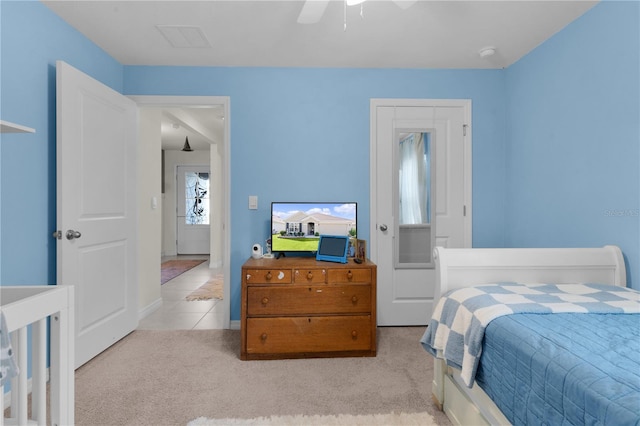 carpeted bedroom featuring ceiling fan