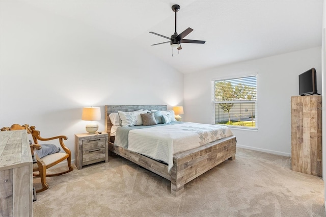 carpeted bedroom featuring lofted ceiling and ceiling fan