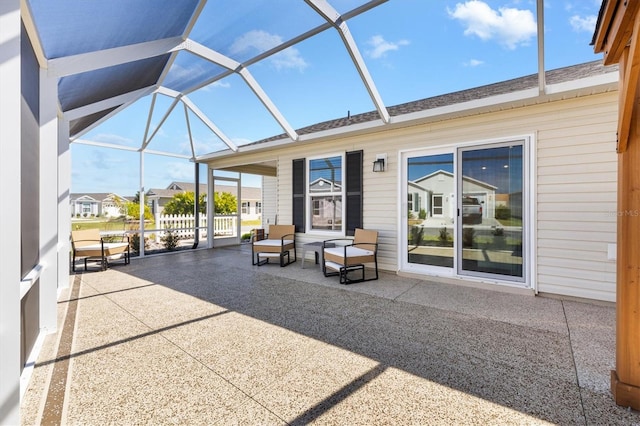 view of patio / terrace featuring a lanai