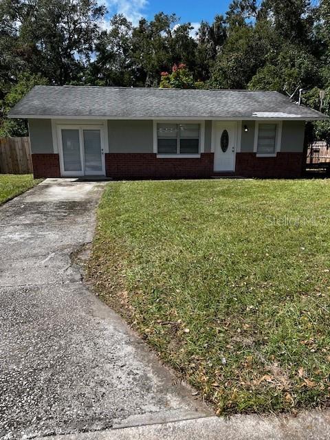 620 Gould St, Eustis, FL 32726 - ranch-style home featuring brick siding and asphalt driveway