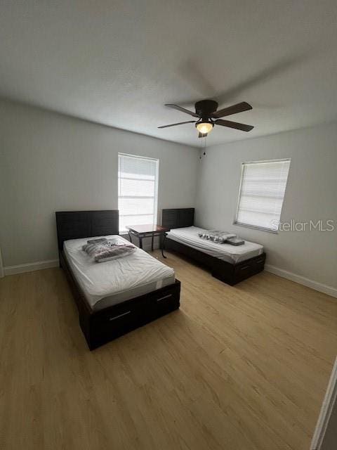 620 Gould St, Eustis, FL 32726 - bedroom featuring wood finished floors, baseboards, and a ceiling fan