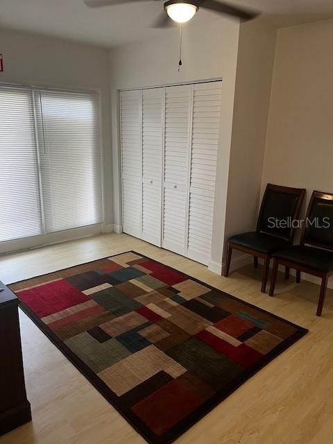 sitting room featuring hardwood / wood-style flooring and ceiling fan