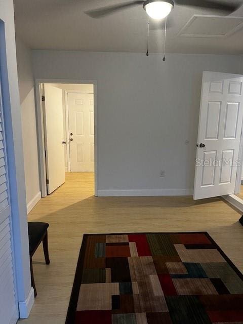 unfurnished room with ceiling fan and wood-type flooring