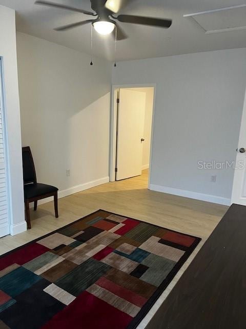 spare room with light hardwood / wood-style flooring and ceiling fan