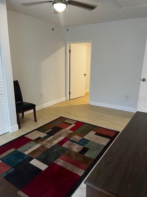 interior space featuring light wood-type flooring and ceiling fan