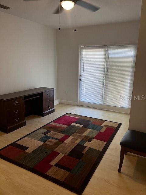 620 Gould St, Eustis, FL 32726 - unfurnished bedroom with light wood finished floors, a ceiling fan, and baseboards