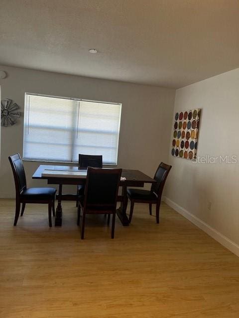 dining area with light wood-type flooring