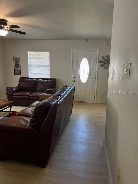 620 Gould St, Eustis, FL 32726 - living area with ceiling fan, baseboards, and light wood-type flooring