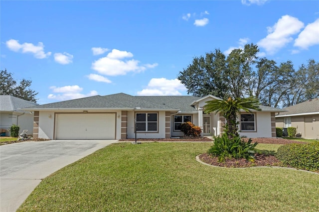 single story home with a front yard and a garage