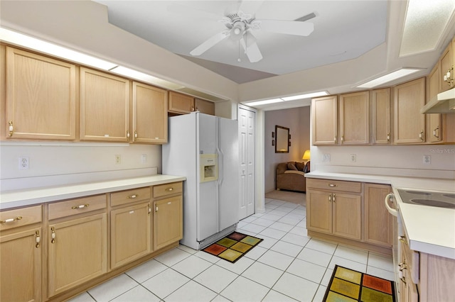 kitchen with light brown cabinetry, light tile patterned flooring, white appliances, and ceiling fan