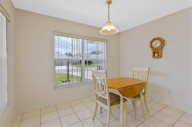 dining area with light tile patterned flooring