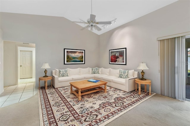 living room with light carpet, high vaulted ceiling, and ceiling fan