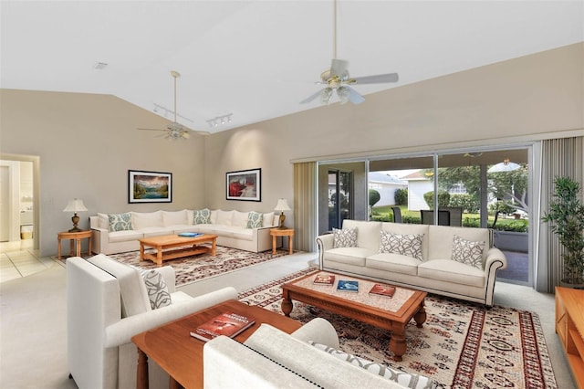 carpeted living room featuring ceiling fan and high vaulted ceiling