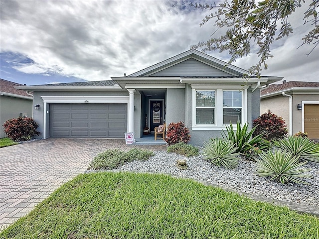 single story home featuring a garage