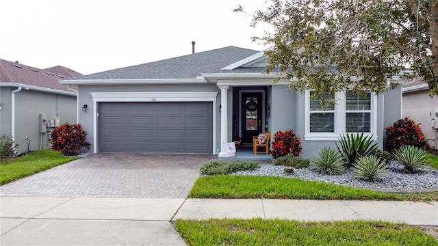 ranch-style house featuring a garage