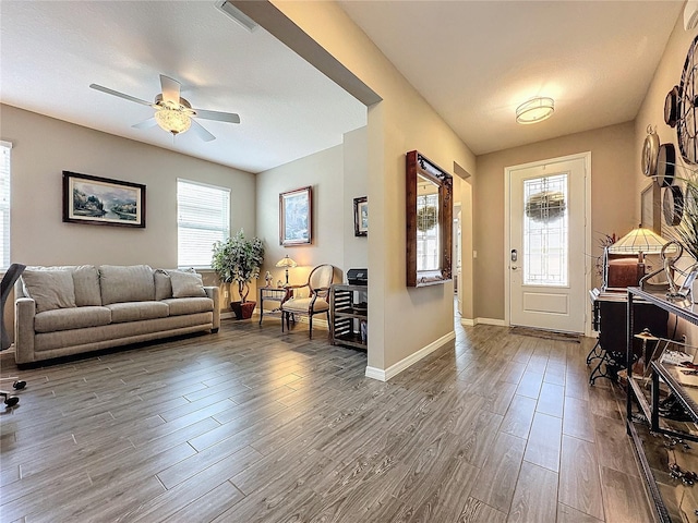 entrance foyer with hardwood / wood-style floors and ceiling fan