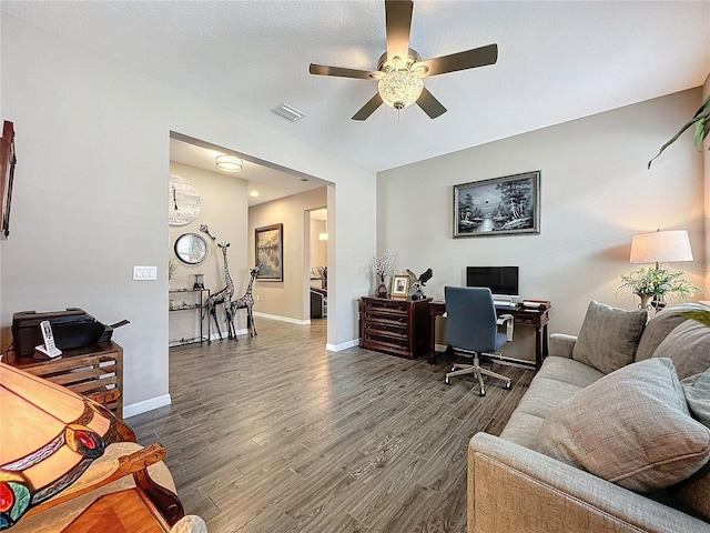 office space with dark hardwood / wood-style floors, a textured ceiling, and ceiling fan